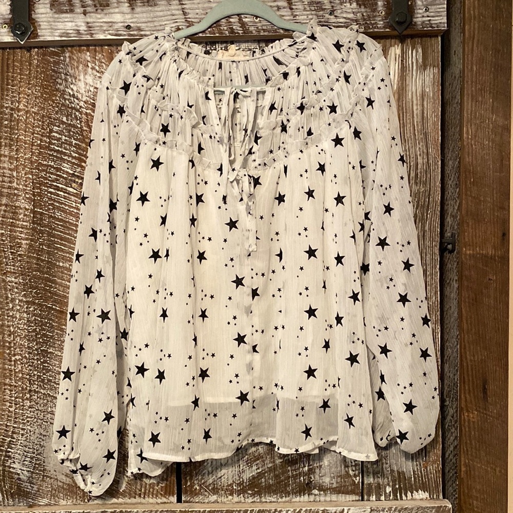 White sheer blouse with black stars